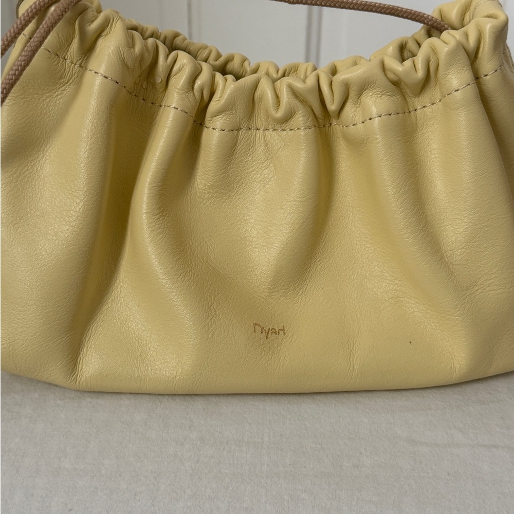 Ruched yellow leather bag project dyad